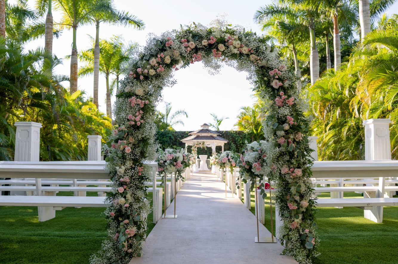 Loveland outdoor ceremony aisle with romantic floral arch and gazebo