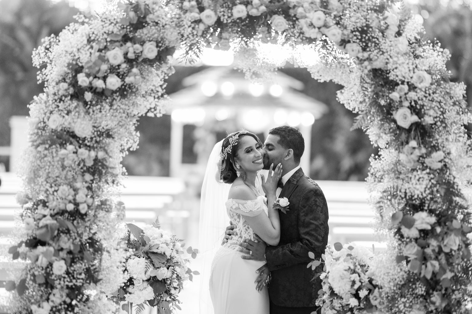 Romantic wedding portrait framed by flowers at Loveland